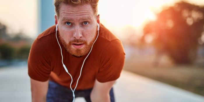 person pausing while on a run