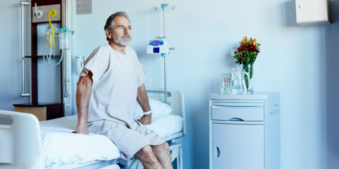 person sitting on a hospital bed