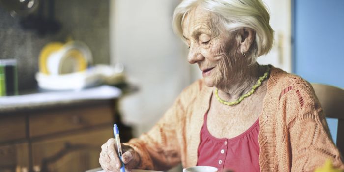 an older lady writing