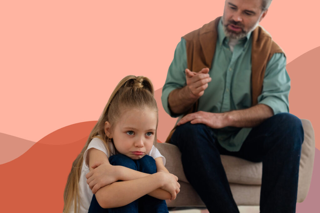 father points finger at girl