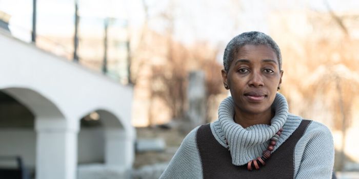 older woman sitting outdoors