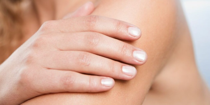 close up of hand on arm