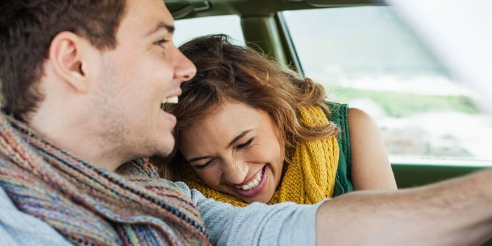 two people enjoying a car drive