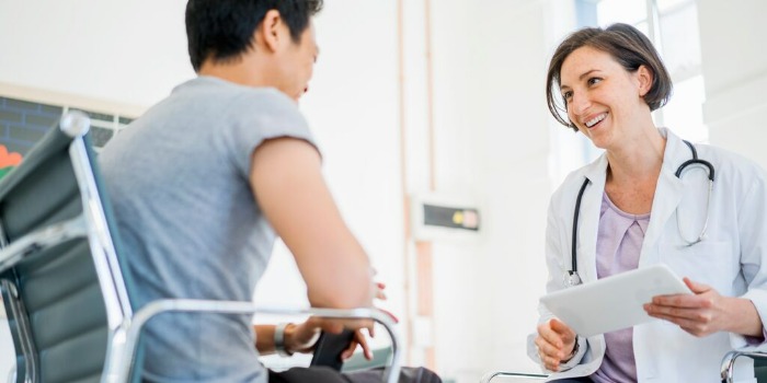 doctor and patient smiling in a consultation