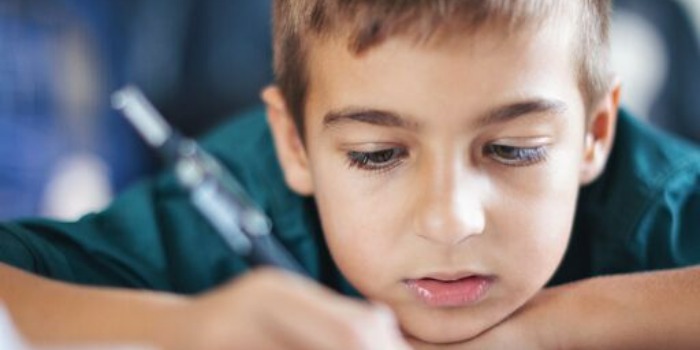 kid doing homework at home