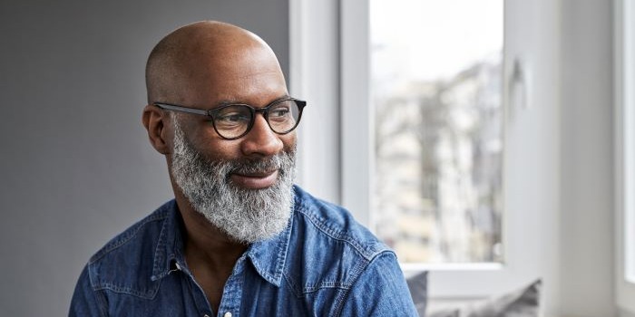 man in blue shirt and glasses