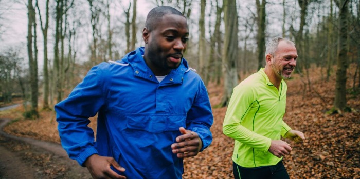 two runners in the woods