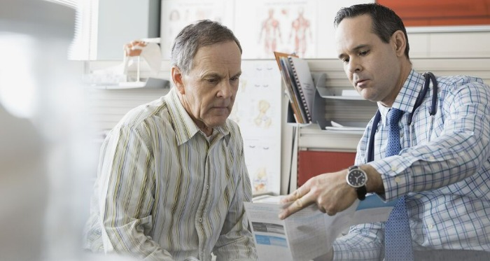 doctor going over a report with a patient