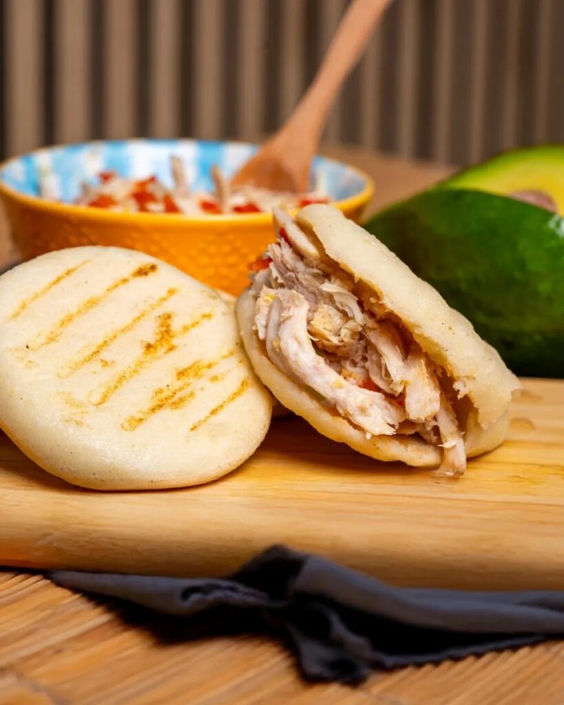 Tasty arepas stuffed with savory shredded chicken, perfect for a hearty meal.